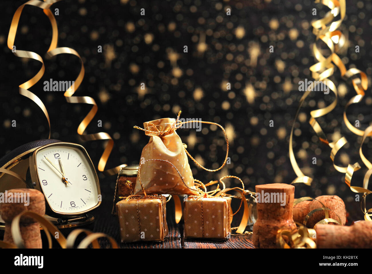 New year clock and champagne cap on wooden background. Happy New Year 2018 Stock Photo