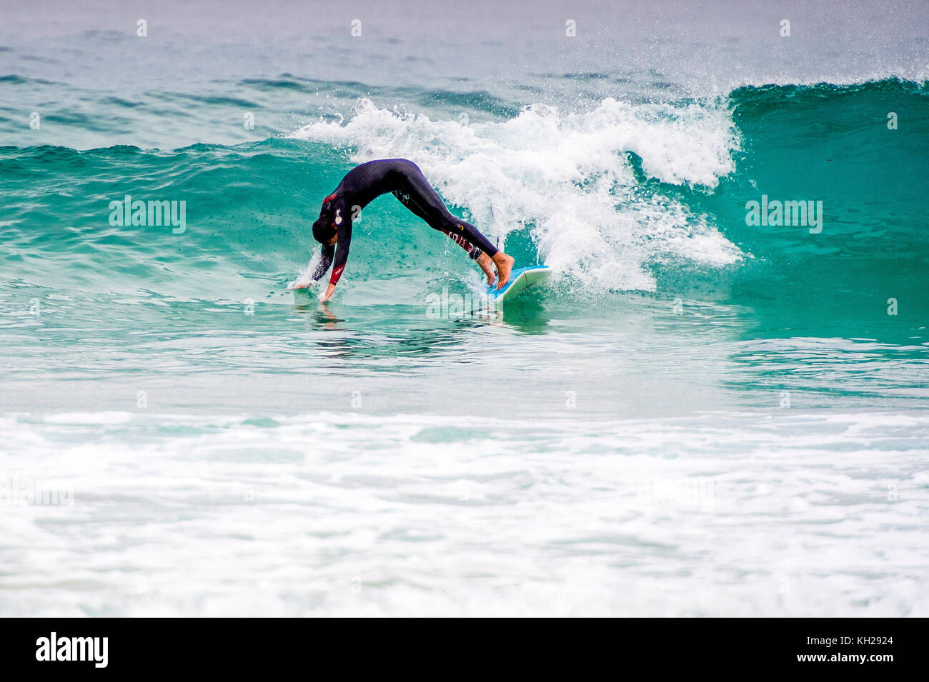 A surfer wipes out at Bondi Beach, Sydney, NSW, Australia Stock Photo