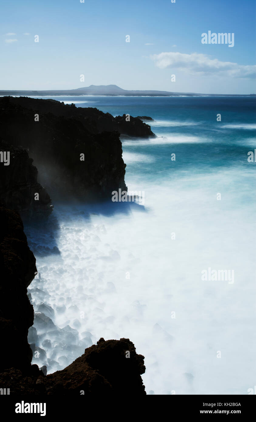 Long time exposure of the sea and rocks/cliffs at a location near Los Hervideros, Lanzarote, Canary Islands, Spain Stock Photo