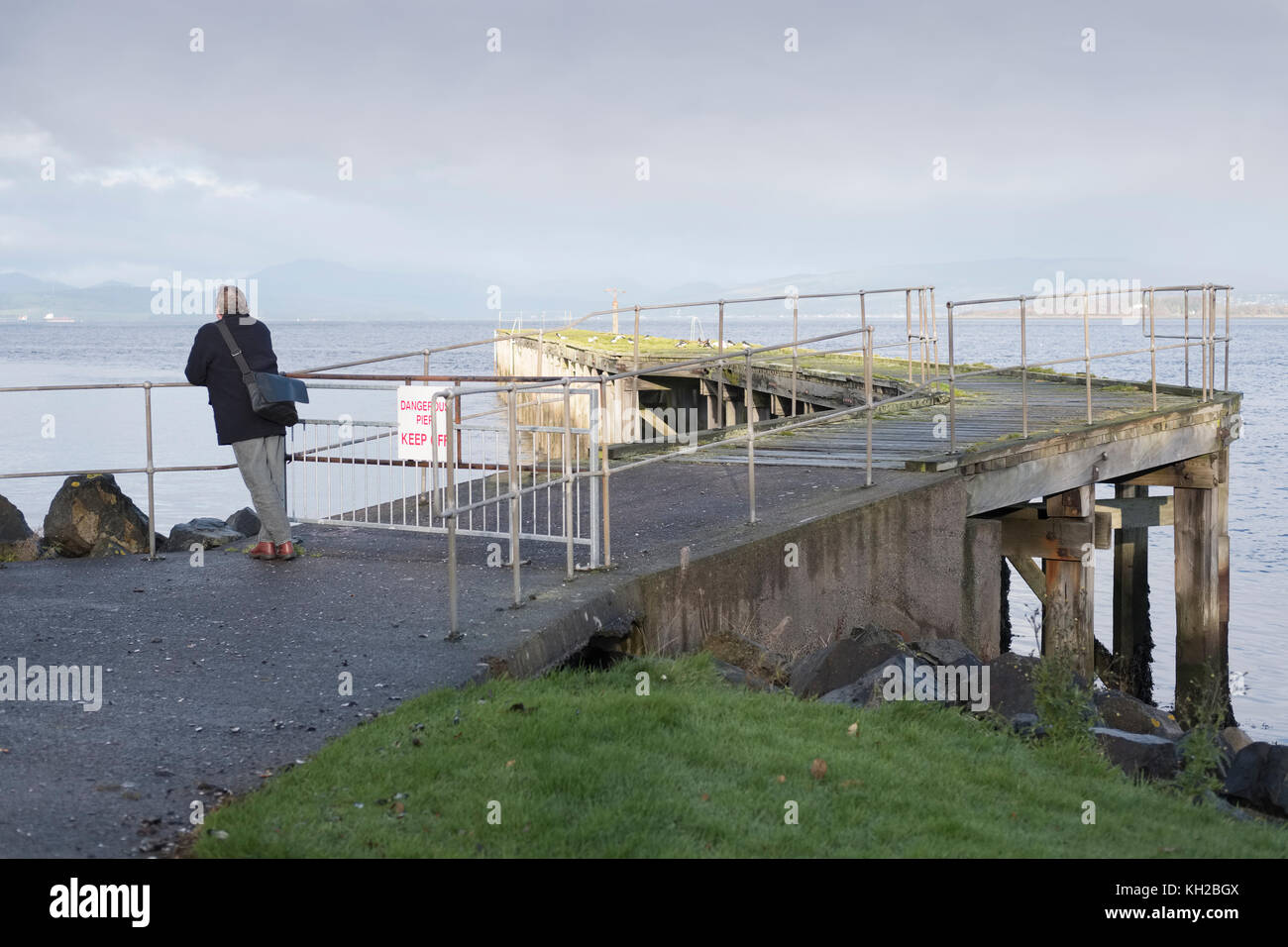 Single Person Man Viewing Sea Landscape Pier Jetty Port Glasgow Scotland Stock Photo