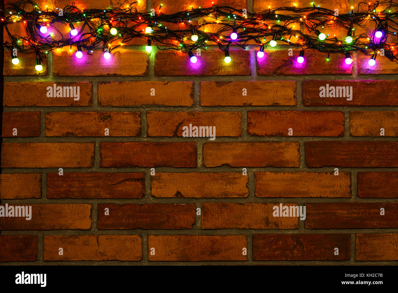 Wreath And Garlands Of Colored Light Bulbs Christmas Background
