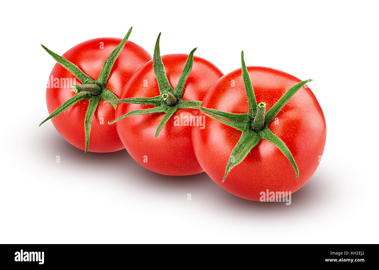 Three fresh red tomato with green leaves isolated on white background ...
