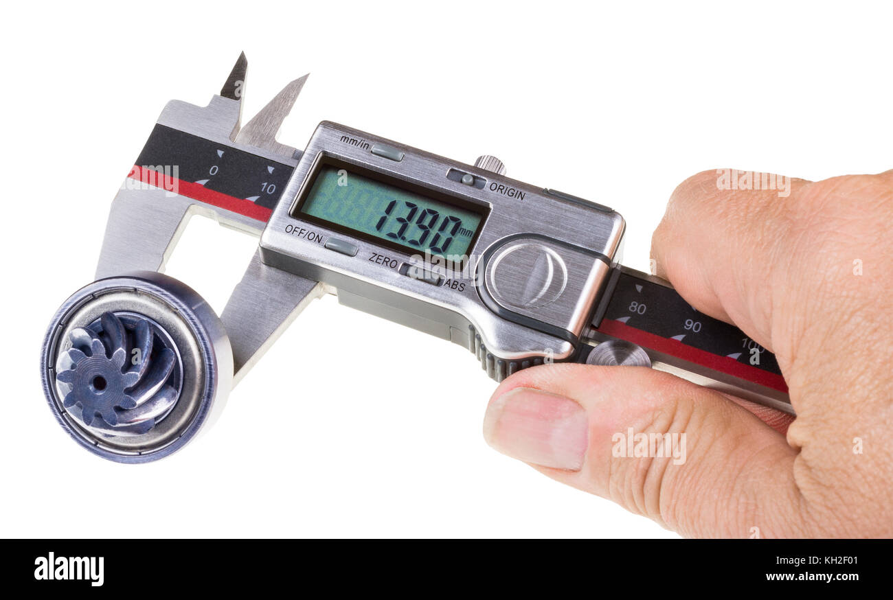 Measuring diameter of gearwheel arbor by digital calipers. The human