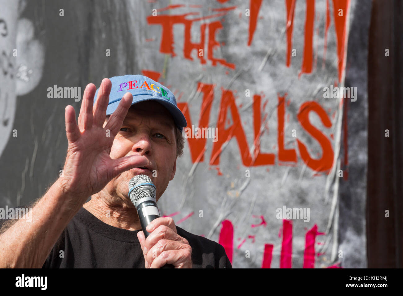 Nogales, Sonora Mexico - 12 November 2017 - Farther Roy Bourgeois speaks at a rally held at the U.S.-Mexico border fence to remember migrants who have died trying to cross the border. Farther Bourgois is the founder of the School of the Americas Watch, which organized the rally. Credit: Jim West/Alamy Live News Stock Photo