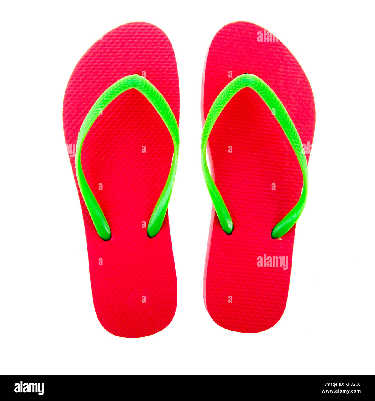 Pink flip flops isolated over white background Stock Photo - Alamy