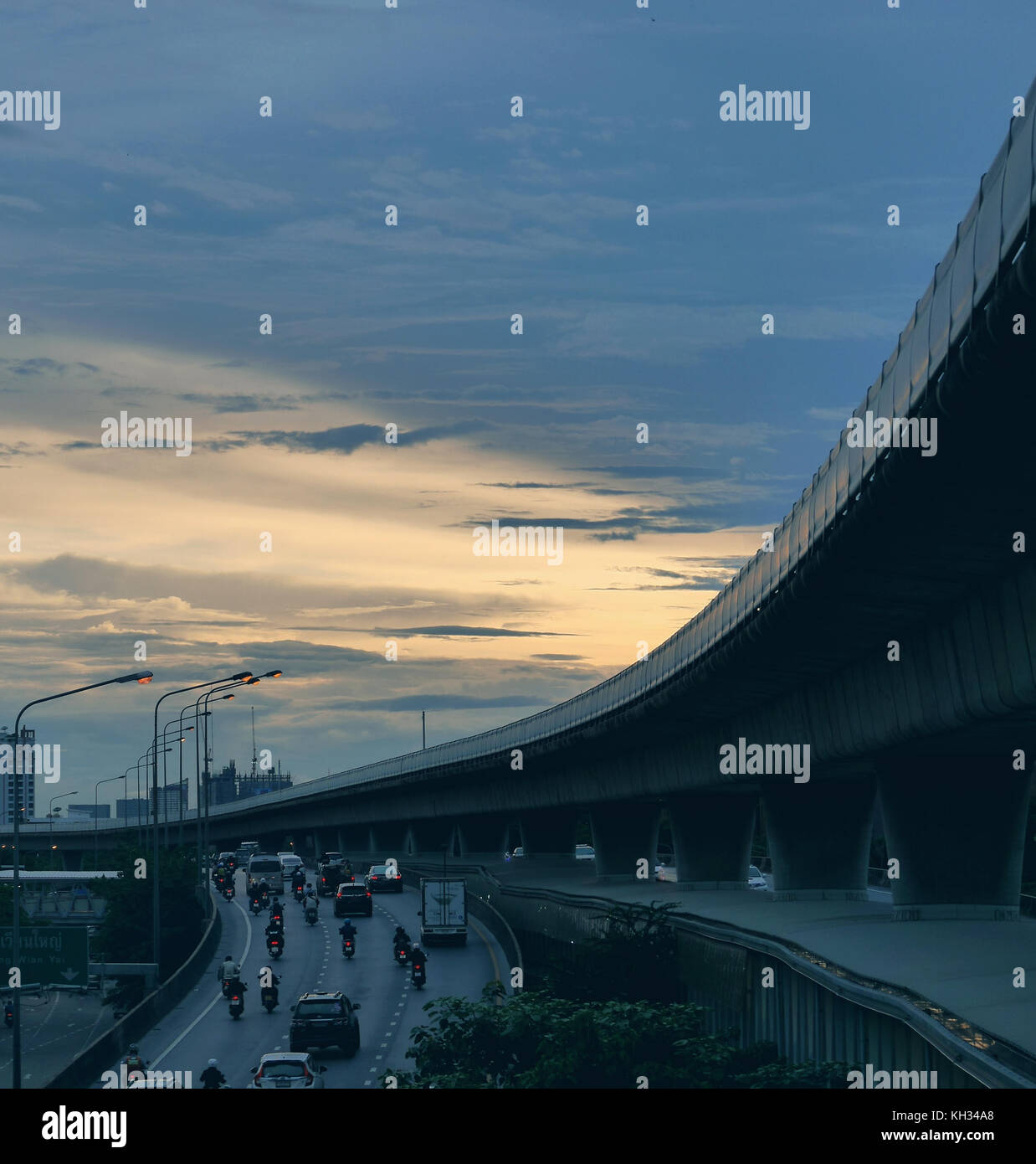 BANGKOK, THAILAND - JUNE 5, 2017: Evening traffic scene of people going home from work at twilight time with beautiful sky lighting Stock Photo