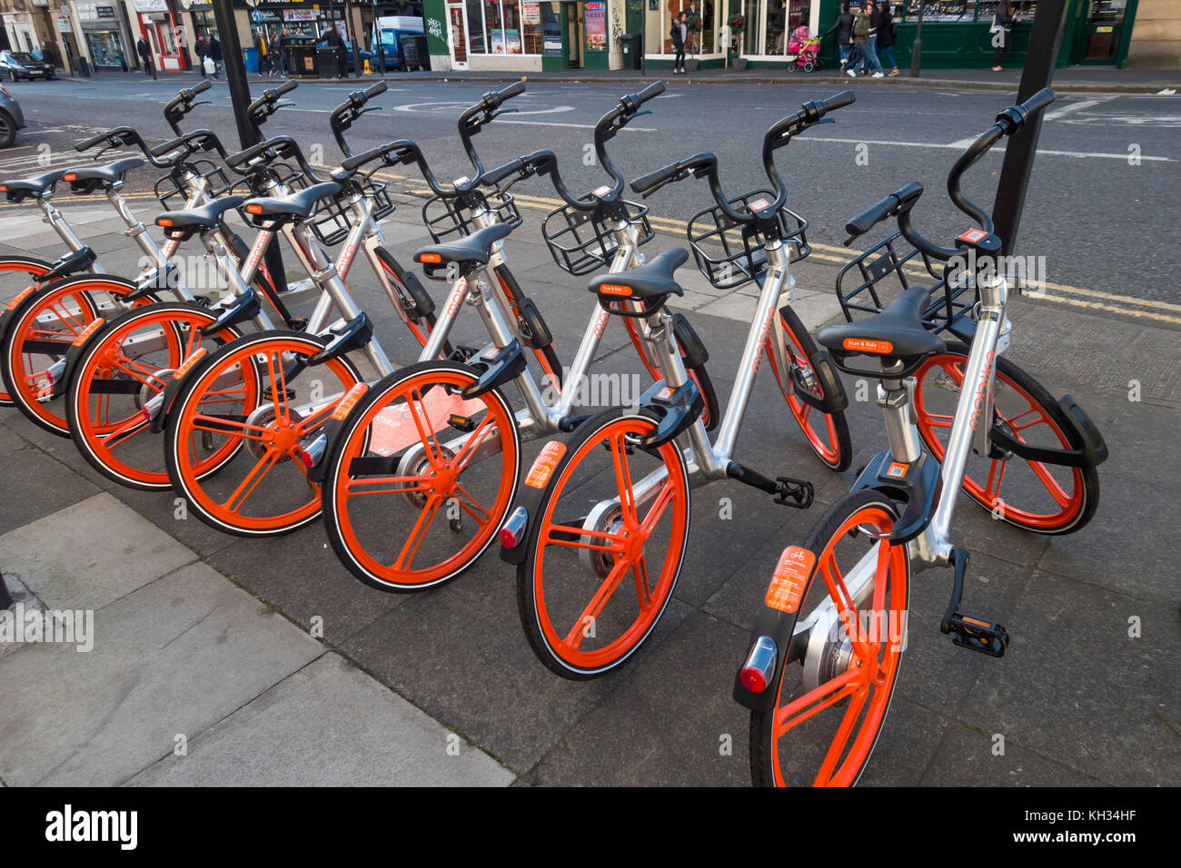 Mobikes that can be hired for use by a mobile phone app have a GPS tracker fitted and may be used and returned anywhere in the City centre Stock Photo