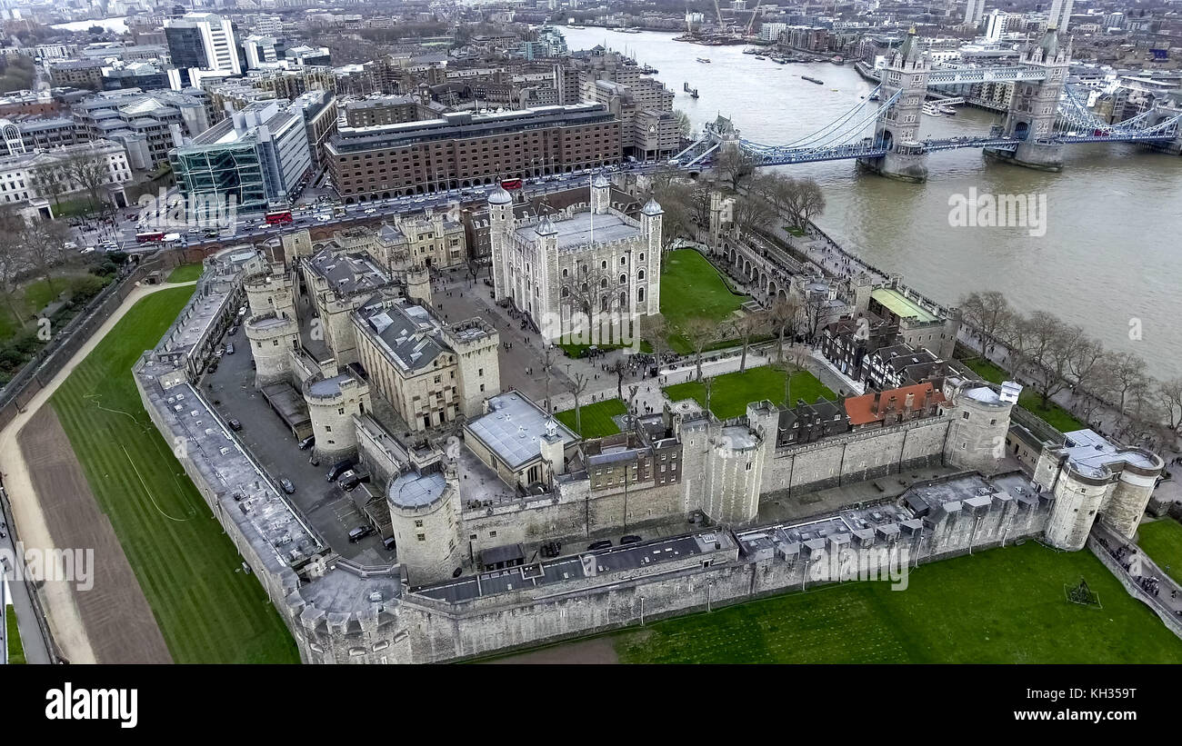 Aerial View Flying Over Tower of London Wall Castle with Tower Bridge and River Thames in England, UK Stock Photo