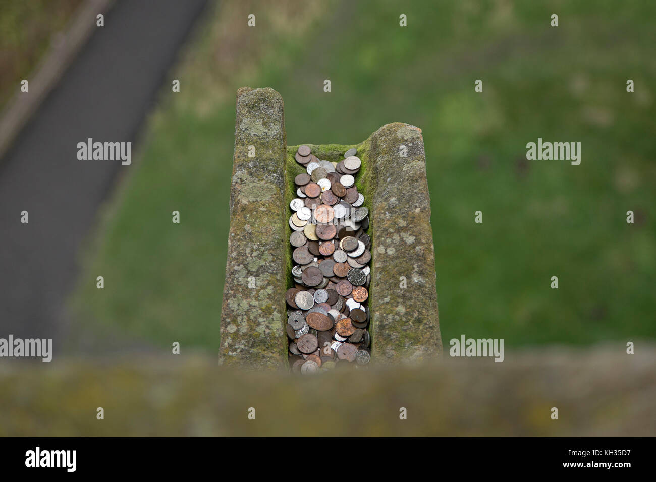 money in rain gutter, Wallace Monument, Stirling, Scotland, Great Britain Stock Photo