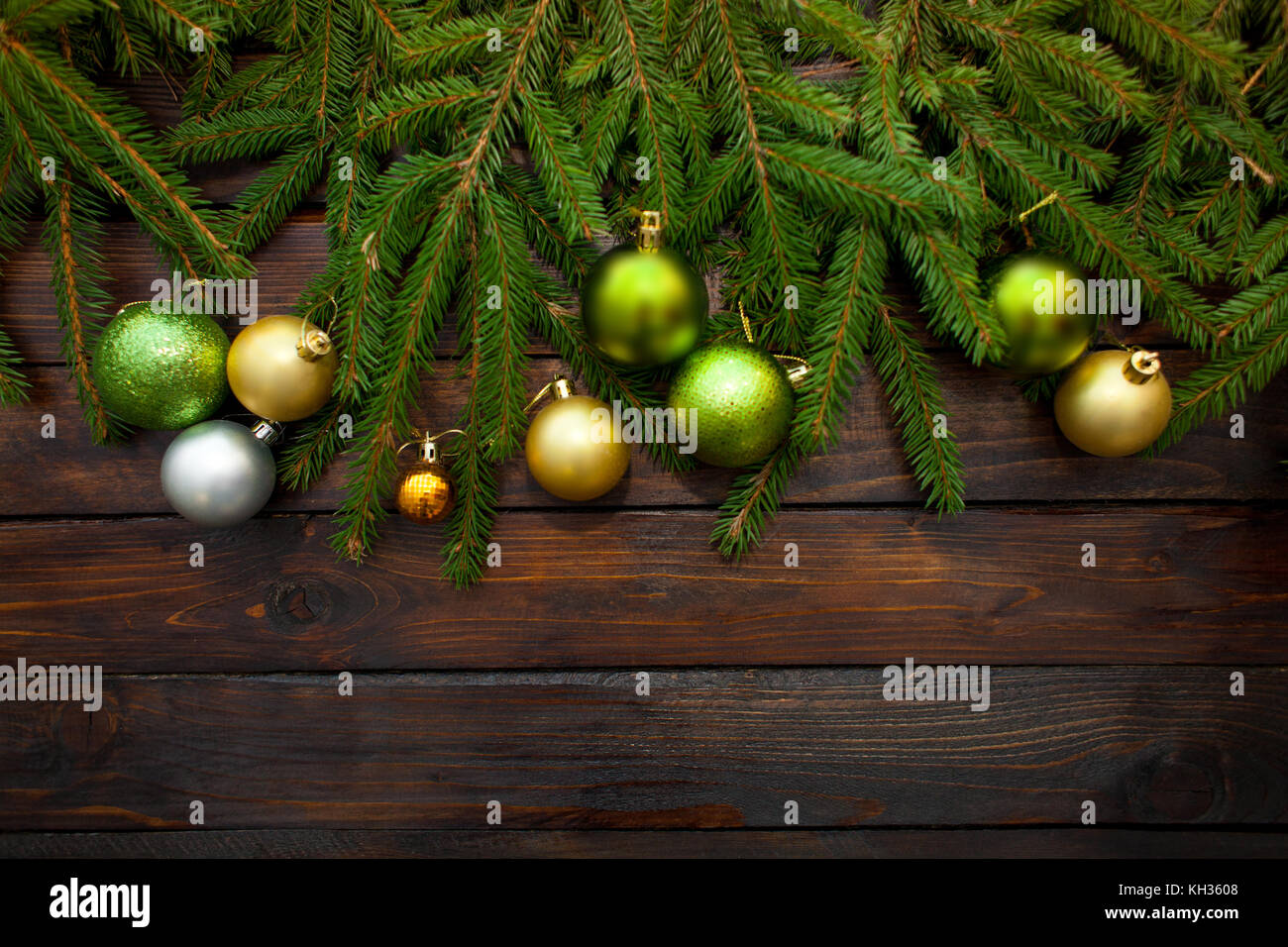 New Year's greens, yellow and silver balls with live fir branches on a
