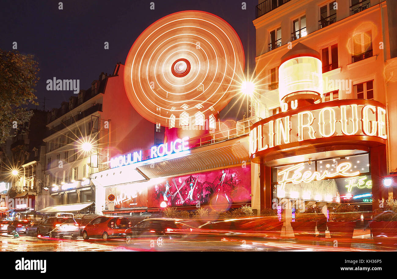 The Moulin Rouge By Night, Paris, France. It Is A Famous Cabaret Built ...