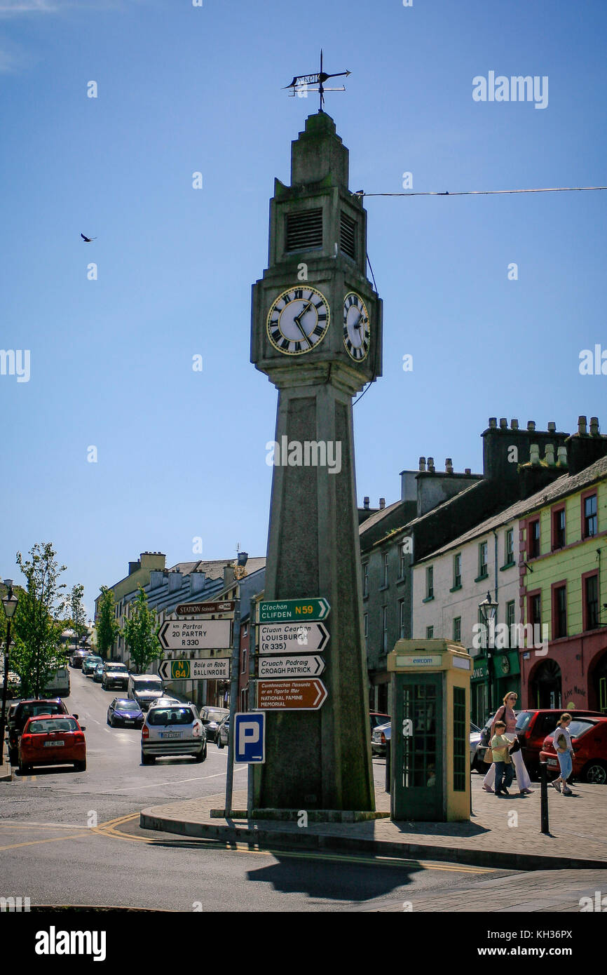 Clock tower and an old phone booth standing in the centre of Westport town, county Mayo, Ireland Stock Photo