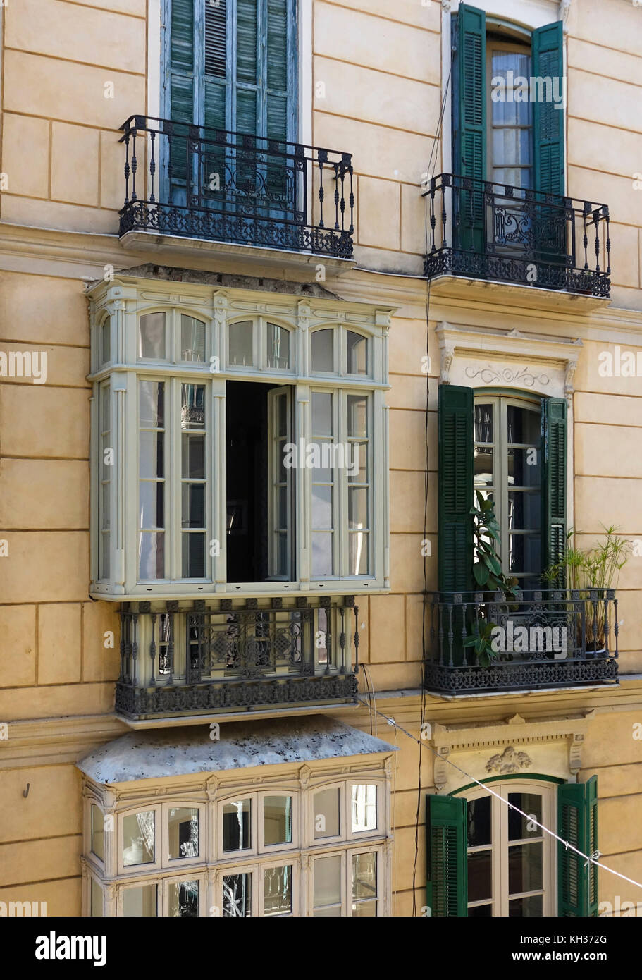 Spanish andalusian style facade, with shutters and balcony, Malaga