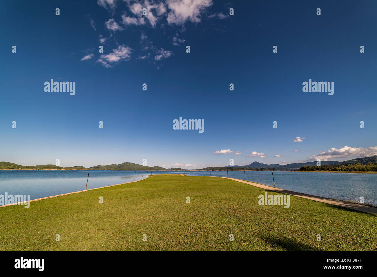 Tranquil  Nature  Scene of Lake under blue sky, captured with wide lens Stock Photo
