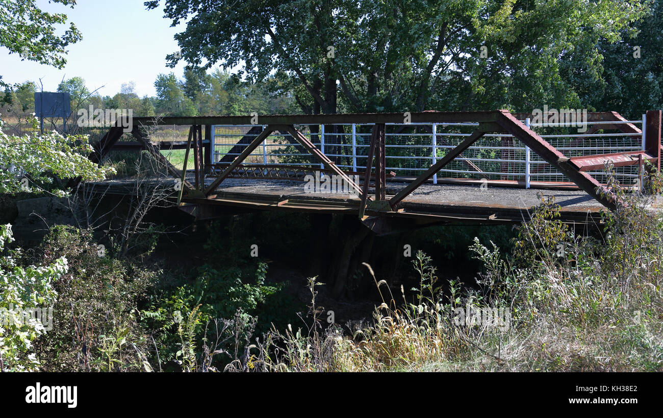 Old abandoned steel bridge over a creek Stock Photo Alamy