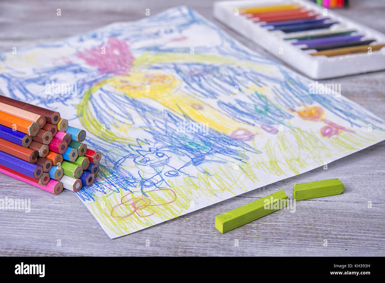 Child painting in the preschool with crayons Stock Photo - Alamy