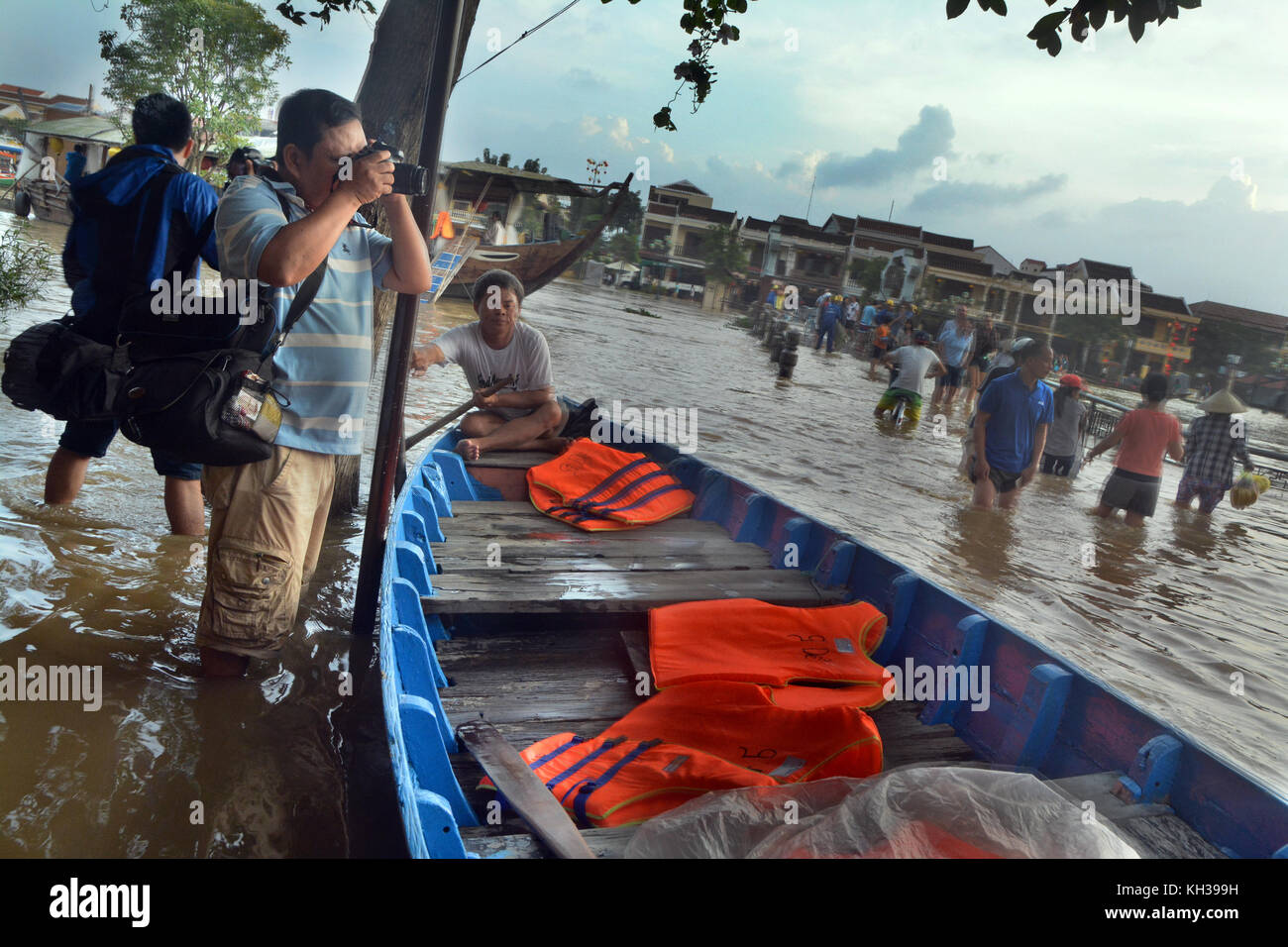 A man tekes a picture of Significant Flooding in Hoi An, Vietnam Stock Photo