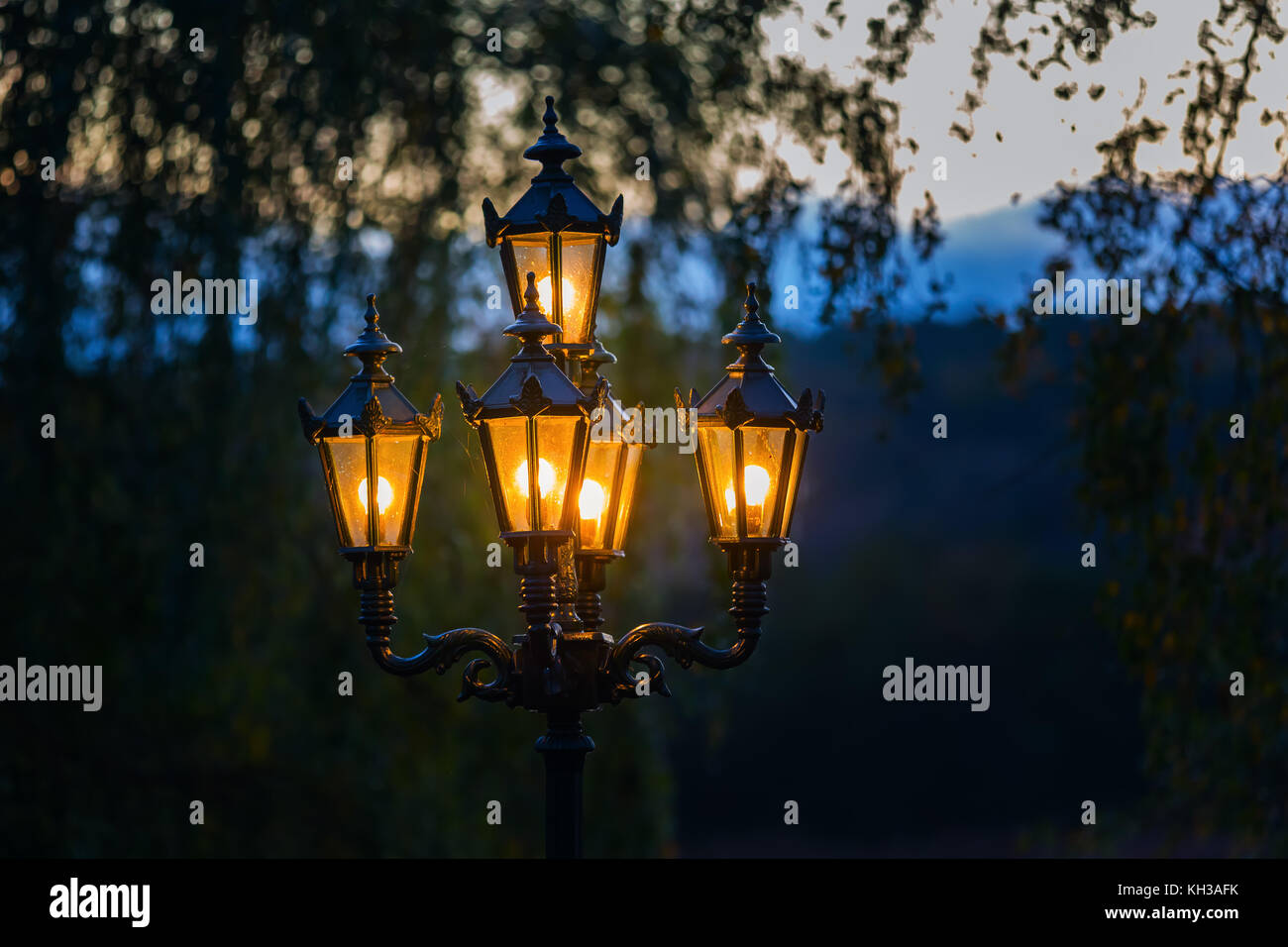 picture of illuminated old street lamps at dusk Stock Photo - Alamy