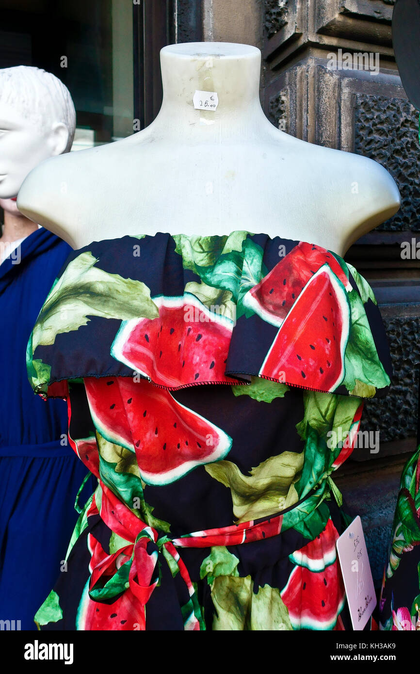 Female vintage 1950s style dress with watermelon pattern design on mannequin. On display outside a shop. Stock Photo
