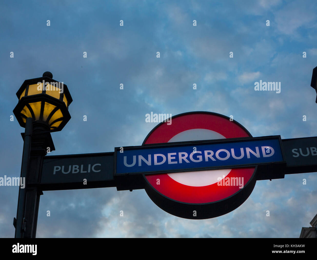 An underground tube station sign at dusk Stock Photo
