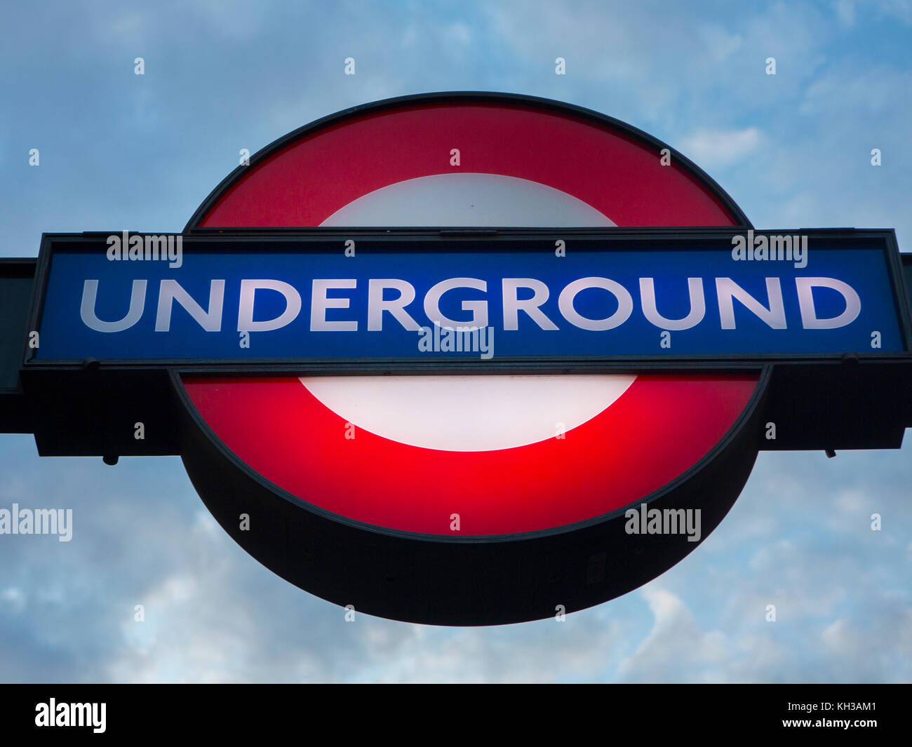An underground tube station sign at dusk Stock Photo