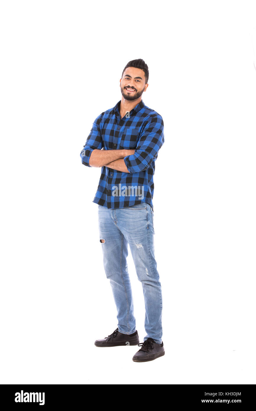 Full-length shot of handsome happy beard young man smiling and standing confidently, guy wearing blue Caro shirt and jeans, isolated on white backgrou Stock Photo