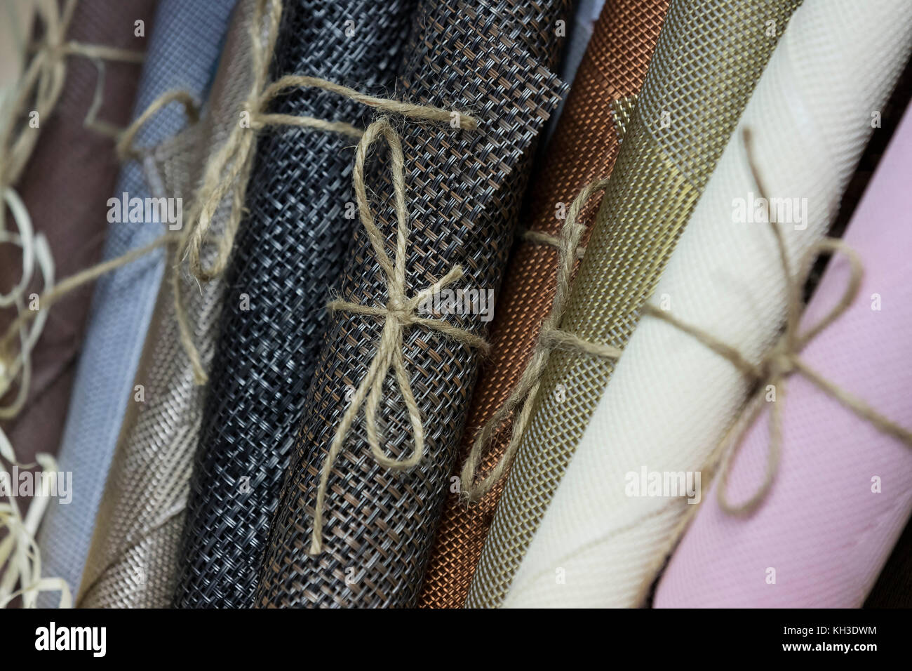 Rolls of wrapping paper binding with rope Stock Photo Alamy