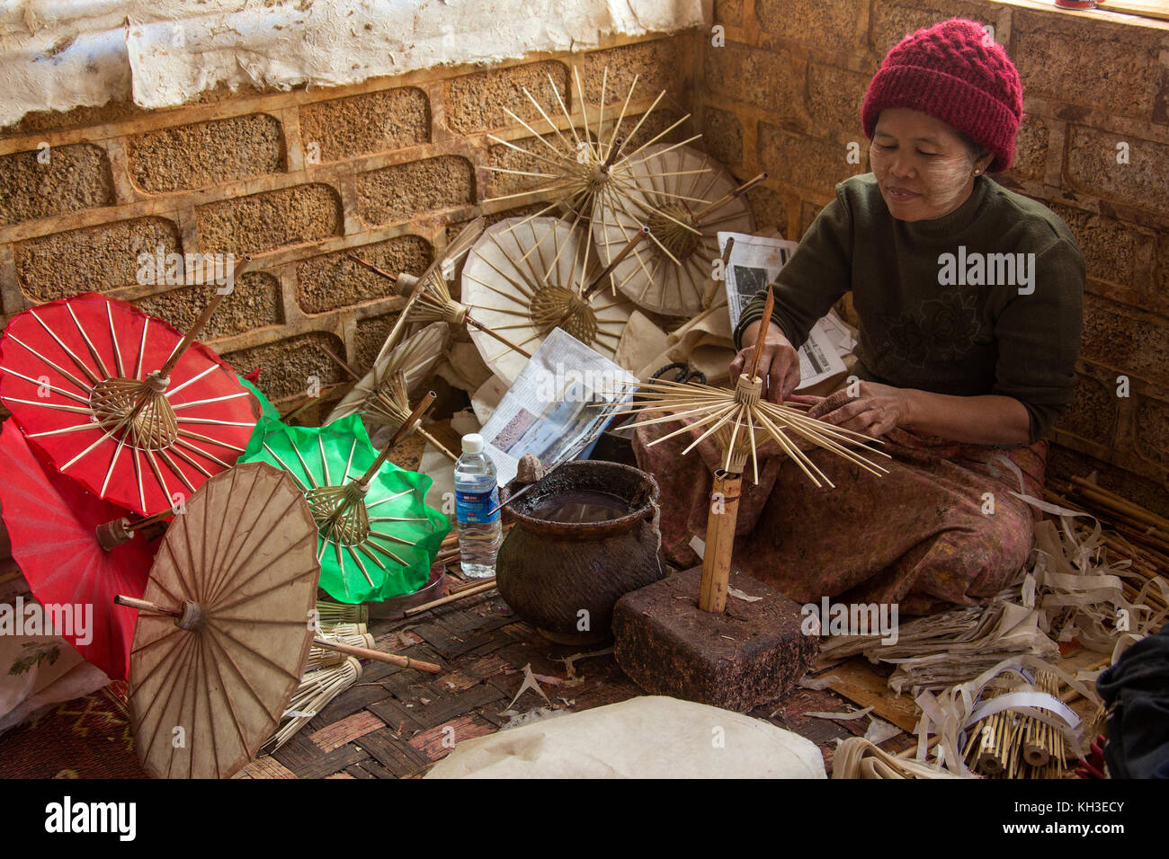 Cottage Industry A Burmese woman making umbrellas in her home near