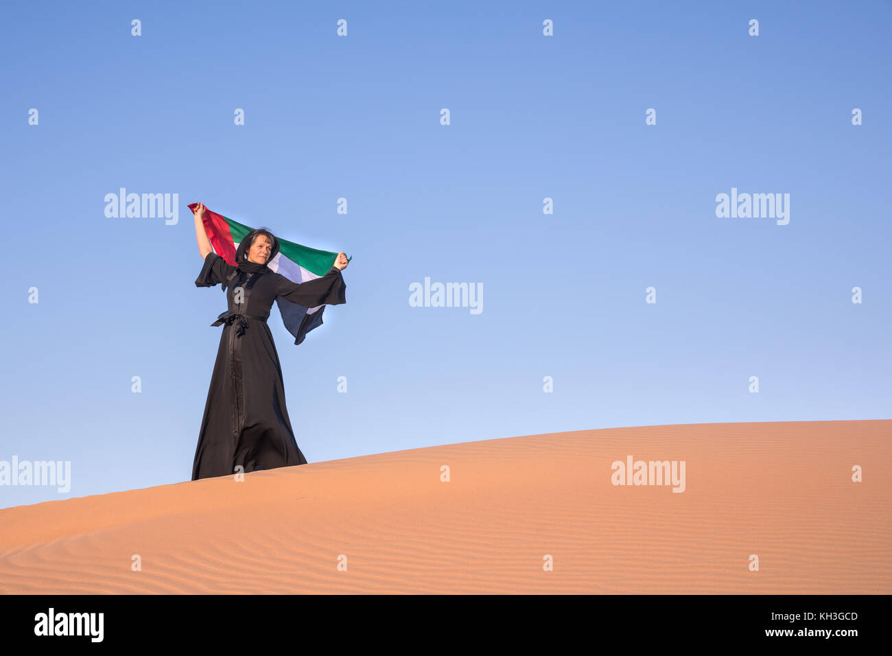 Beautiful Woman In The National Uae Dress Abaya Holding The United Arab Emirates Flag In The