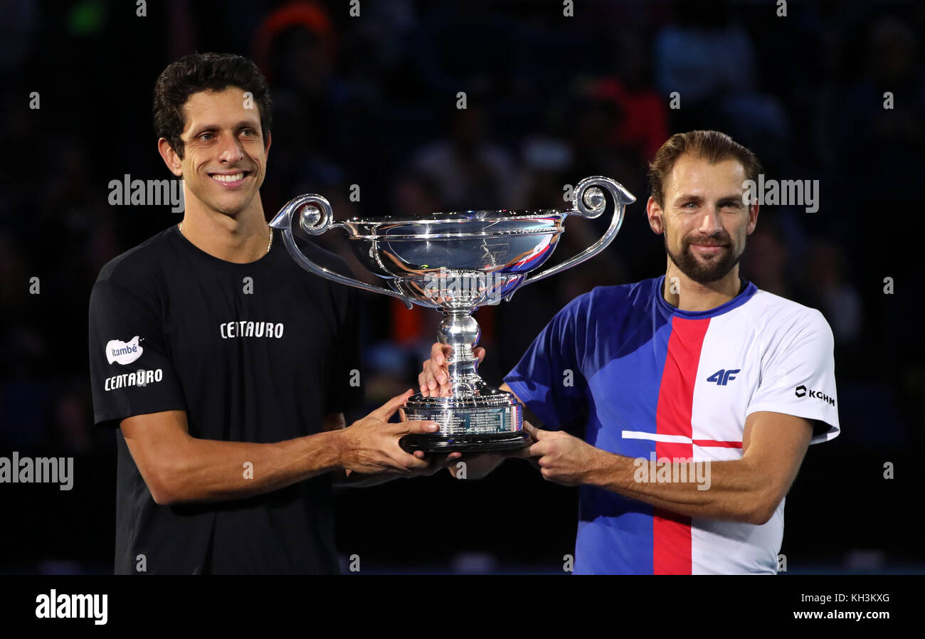 Poland's Lukasz Kubot (right) and Brazil's Marcelo Melo are presented with  a trophy after finishing the year as the number one ranked doubles team  during day two of the NITTO ATP World