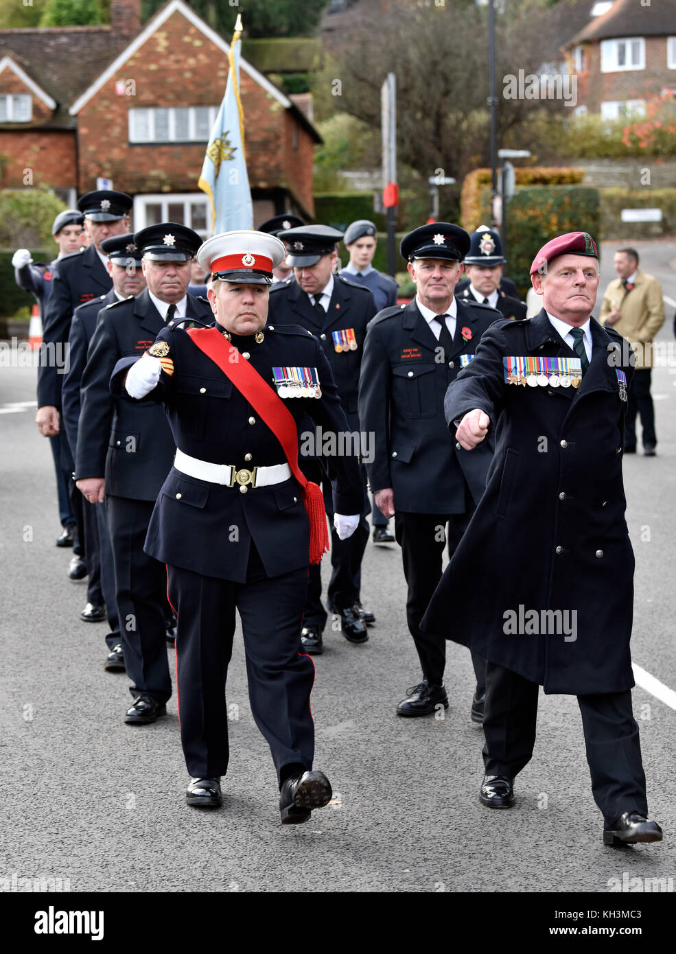 Armed forces and fire brigade marching during Remembrance Sunday ceremony, High Street, Haslemere, Surrey, UK. Sunday 12th November 2017. Stock Photo