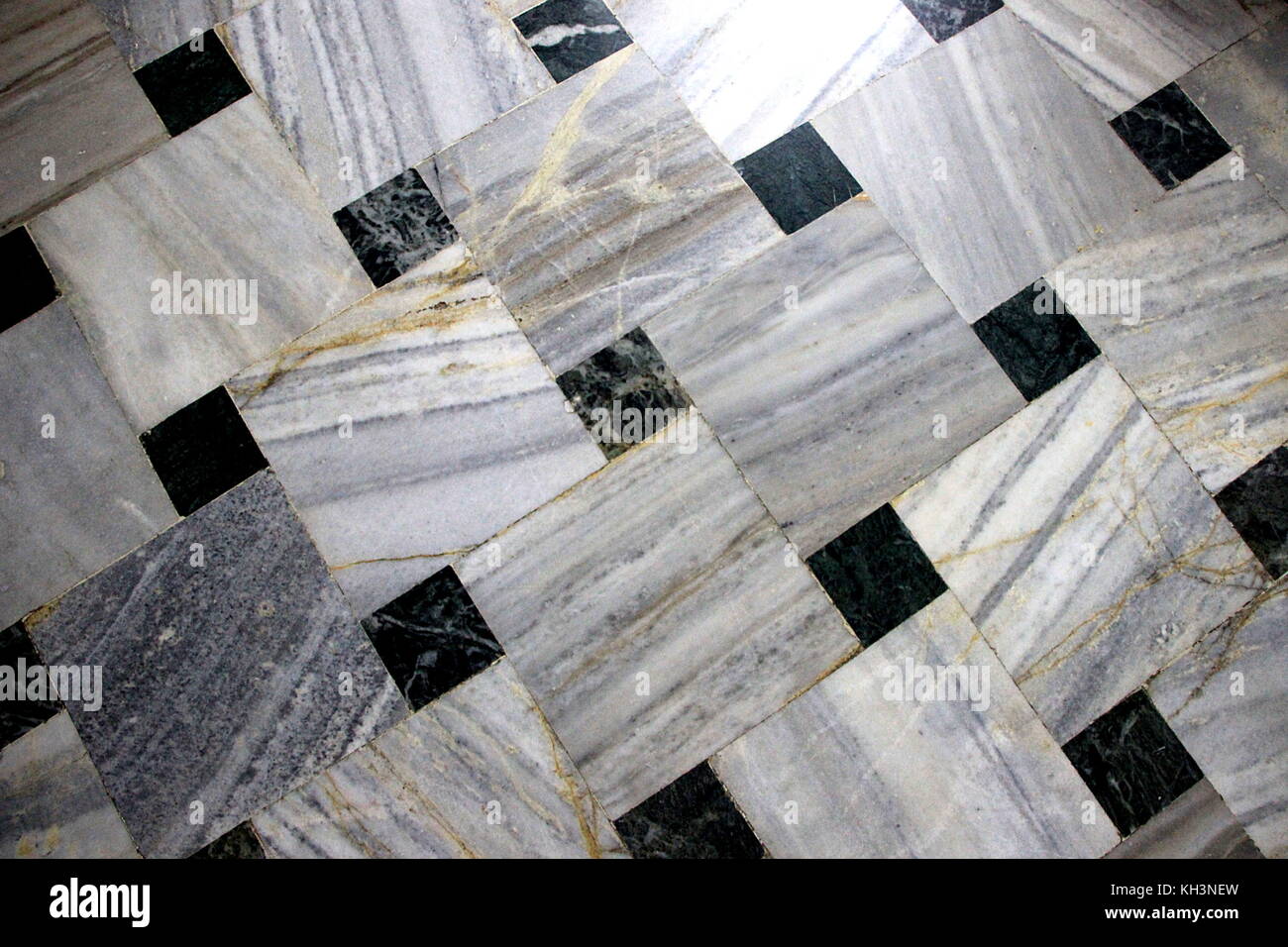 Flooring Inlay work of black and white marble square tiles Stock Photo