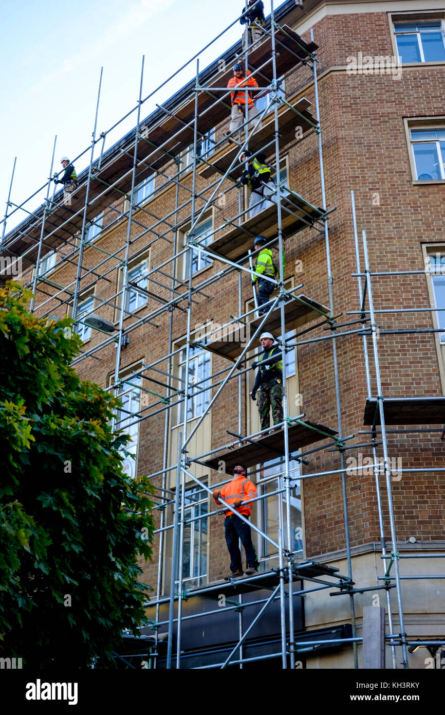 Scaffolders working on a building in Bristol Stock Photo Alamy