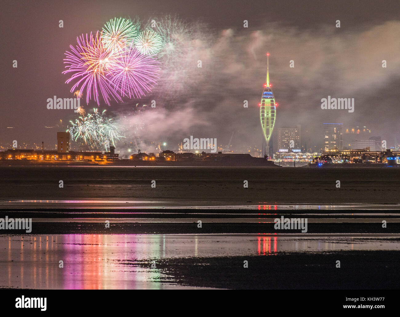 Gun Wharf Quay, Portsmouth, fireworks celebration, with refelctions in the sea, seen from Ryde, Isle of Wight. Stock Photo