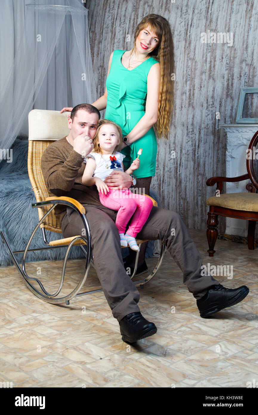 Happy family posing in an interior studio.Isolated portrait Stock Photo ...