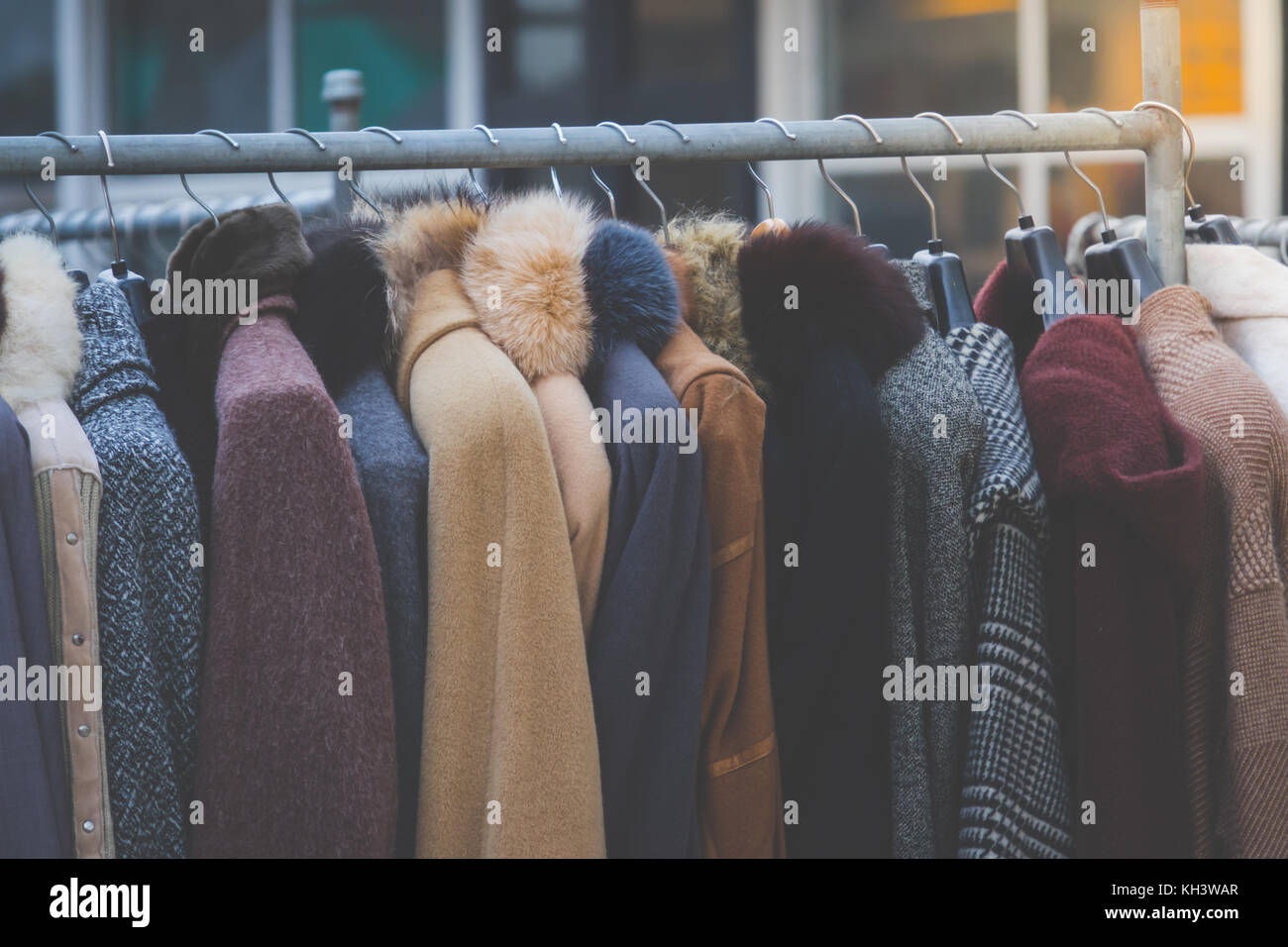 Winter coats hanged on a clothes rack Stock Photo Alamy