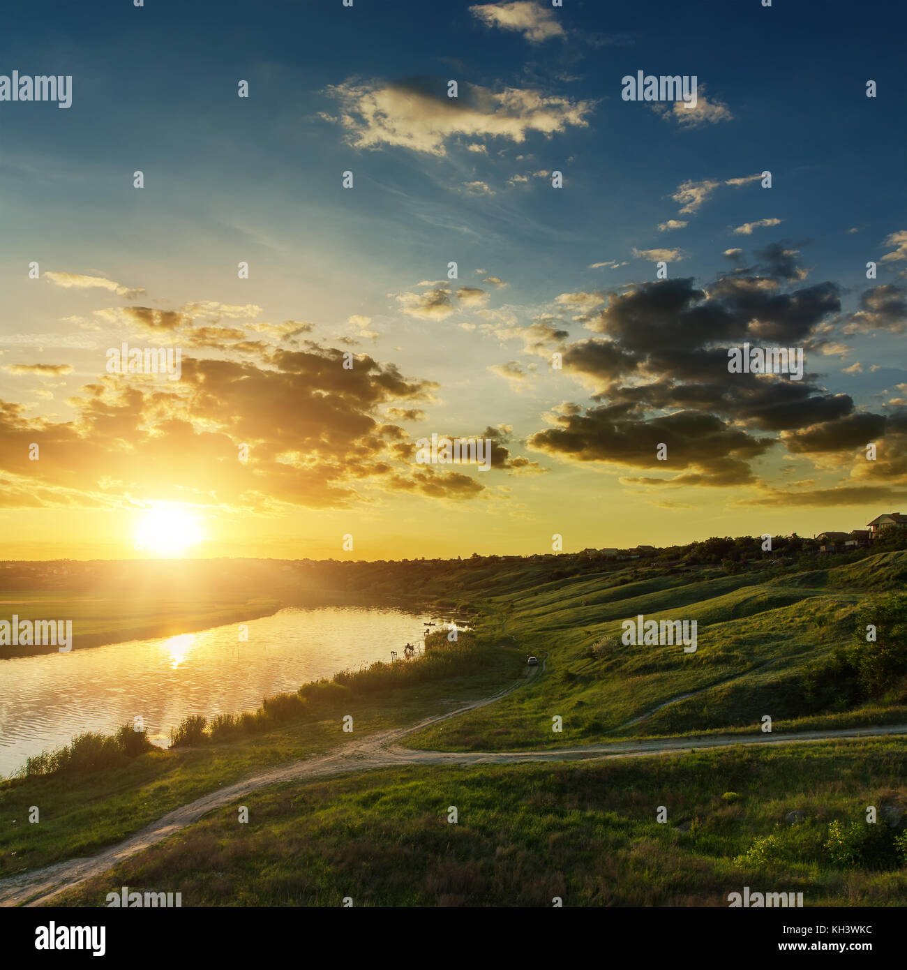 dramatic sunset over river Stock Photo - Alamy