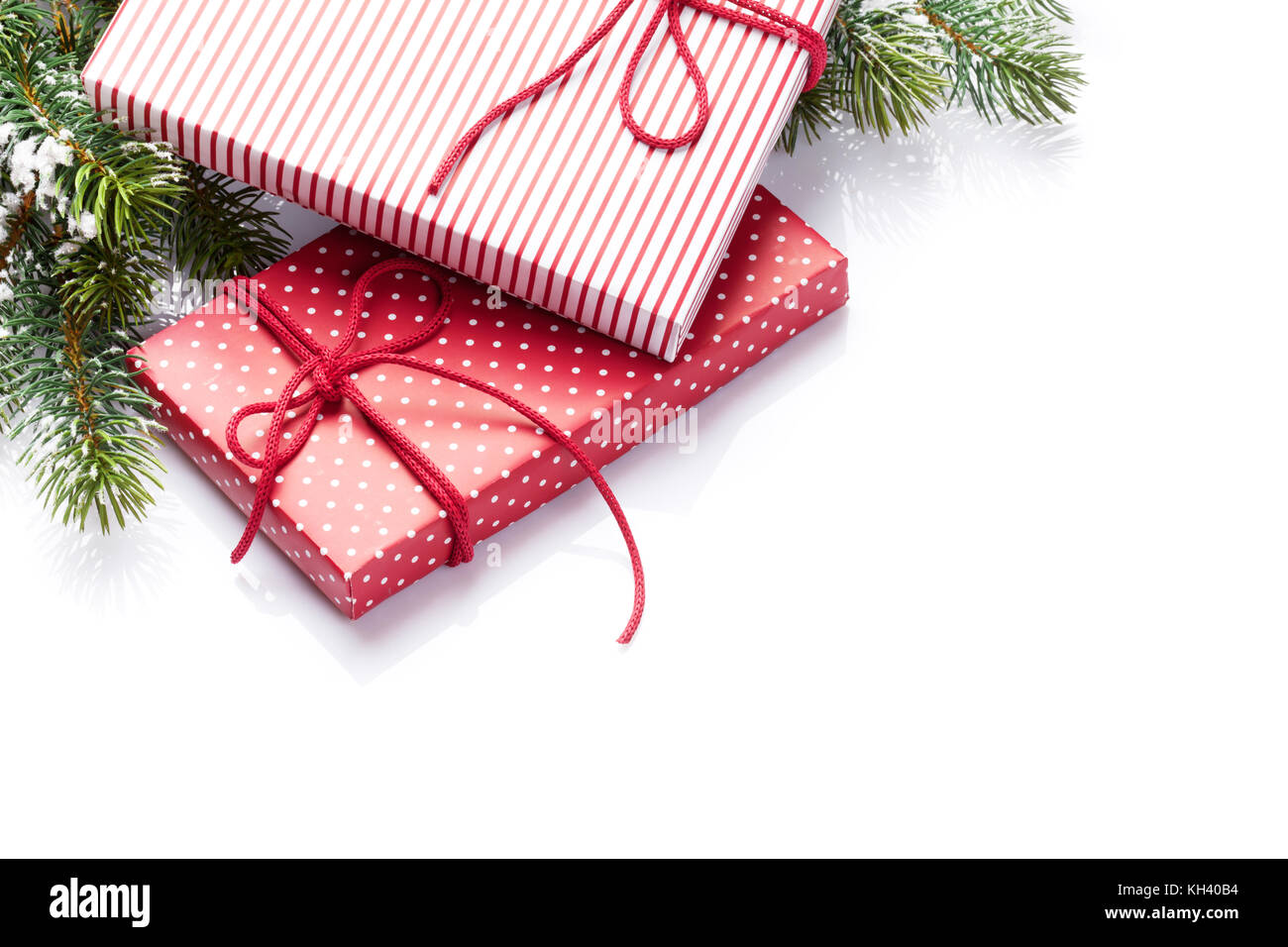 Christmas gift boxes and fir tree. Isolated on white background Stock ...
