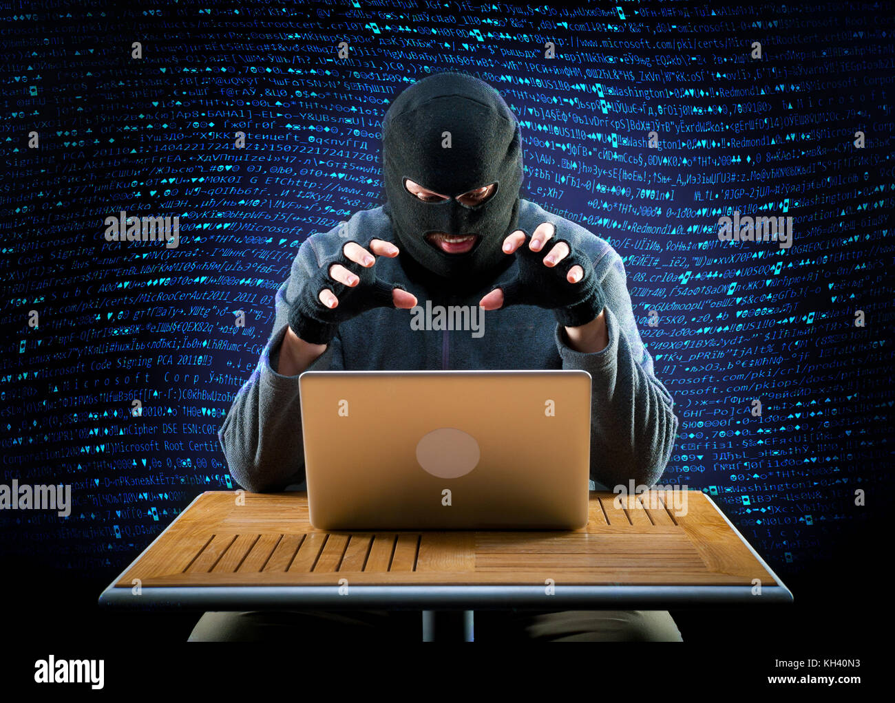 Hacker is ready to start hacking laptop Stock Photo