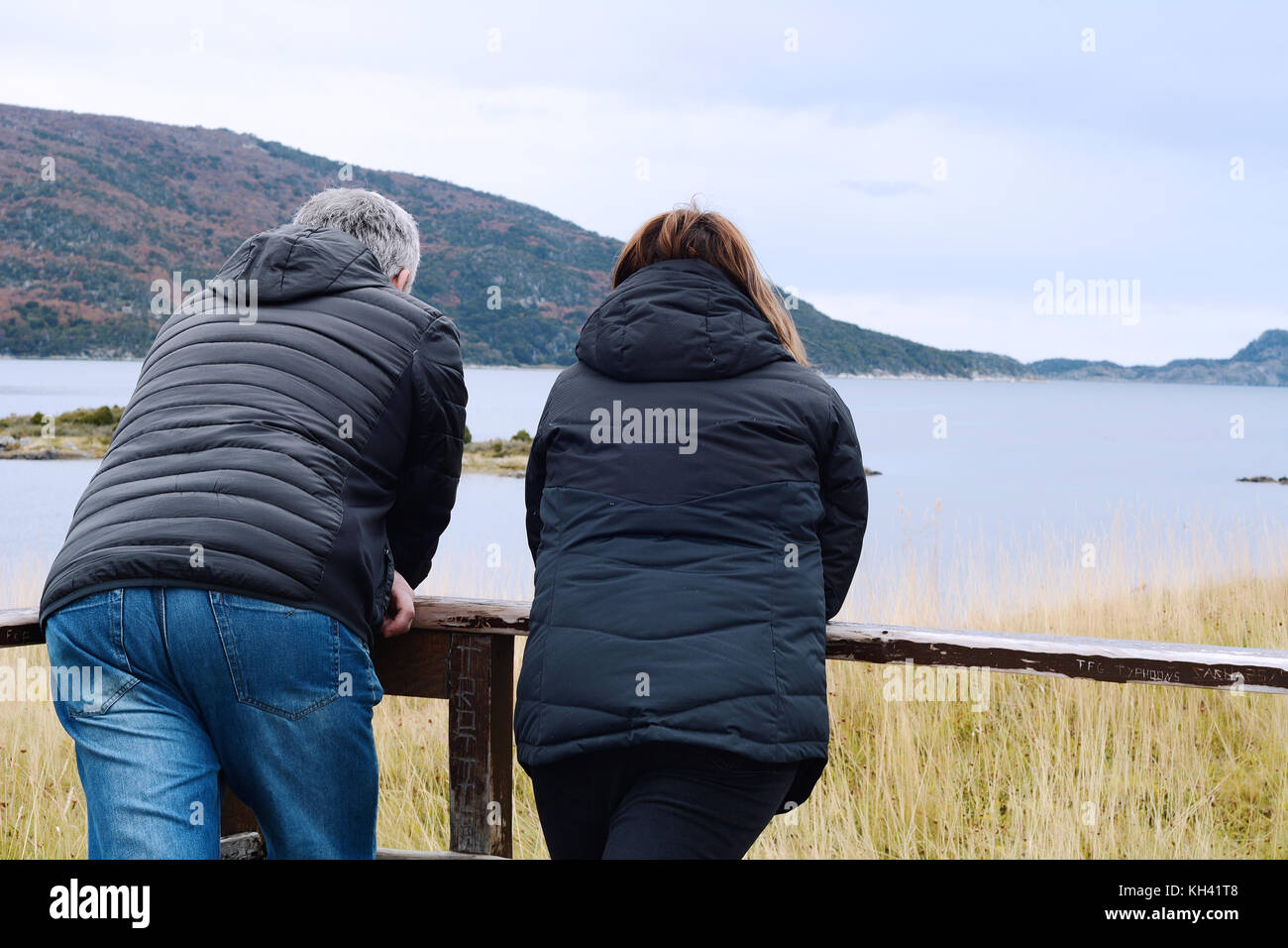 Lovely couple looking to landscape from balcony Stock Photo - Alamy