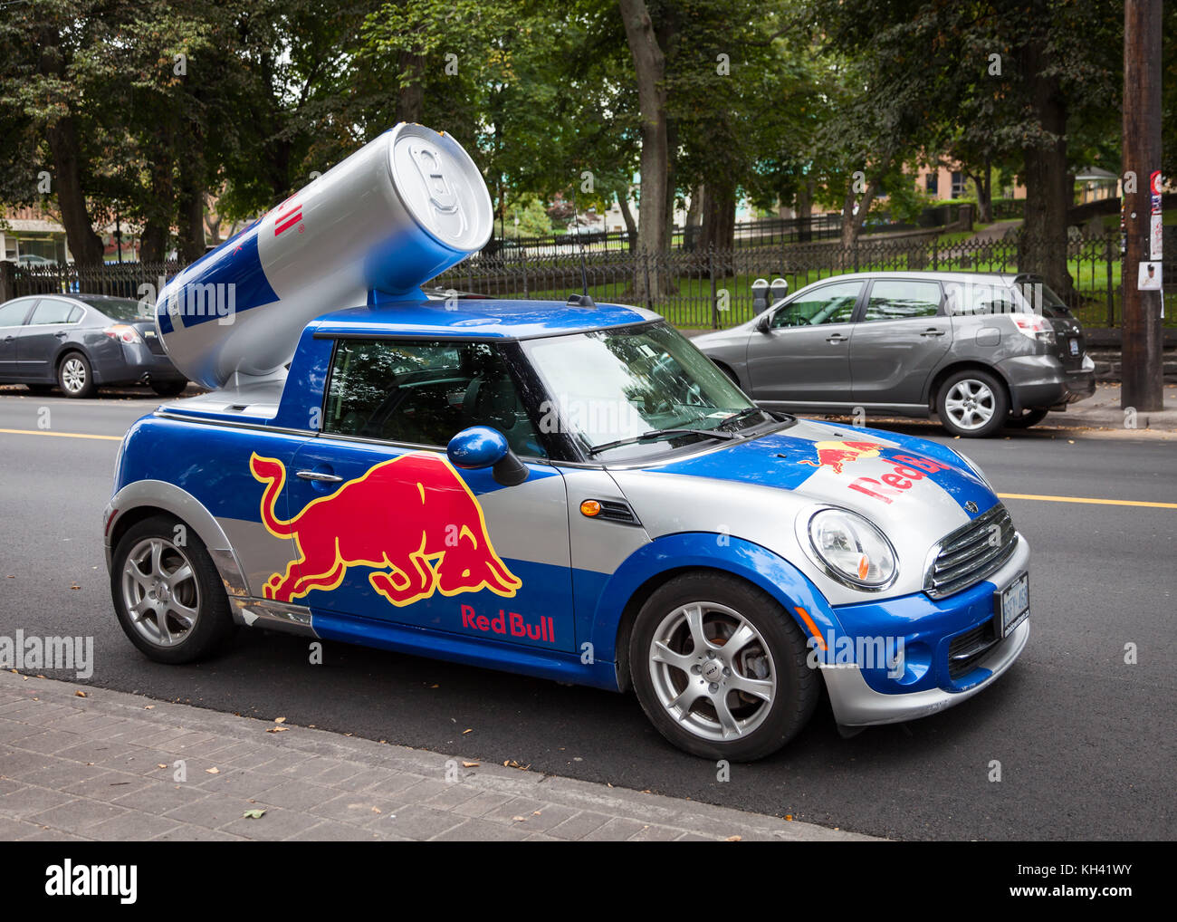 A Red Bull mini cooper publicity car with a can of Red Bull drink in Halifax, Nova Scotia, Canada, Stock Photo