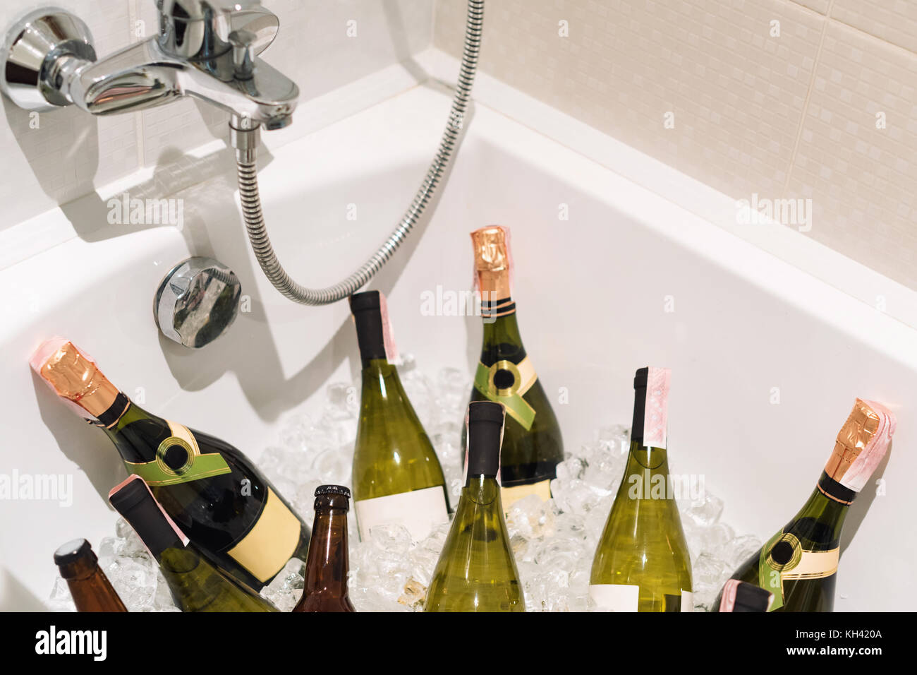 Champagne and beer with ice in the bathroom. Party drinks. Stock Photo