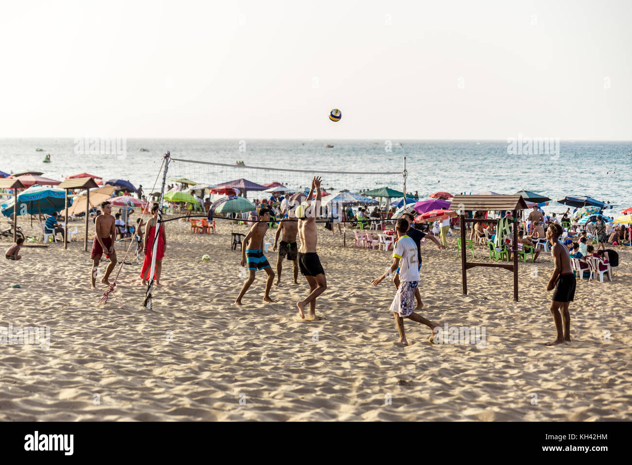 Young people playing volley ball on Saidia beach, in summer Stock Photo
