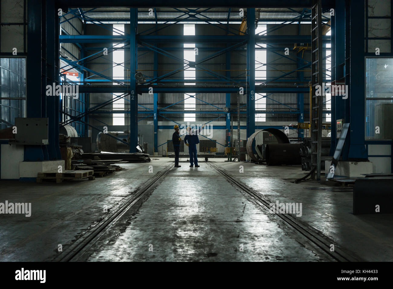 Two workers planning manufacturing process Stock Photo