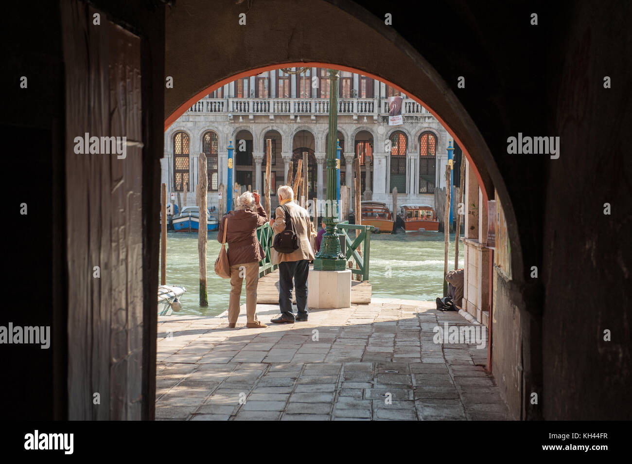 Tourists waiting for the Vaporetto at Grand Canal in Venice, Italy. Venice is a major tourist destination in Italy. Stock Photo