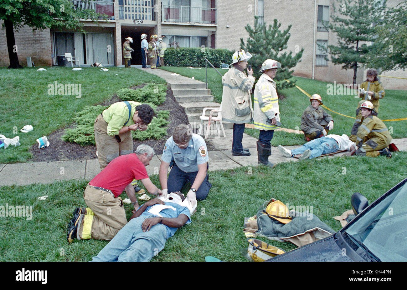 Fire and medical personnel work on people injured when their apartment balcony collapse in Bladensburg, Maryland Stock Photo