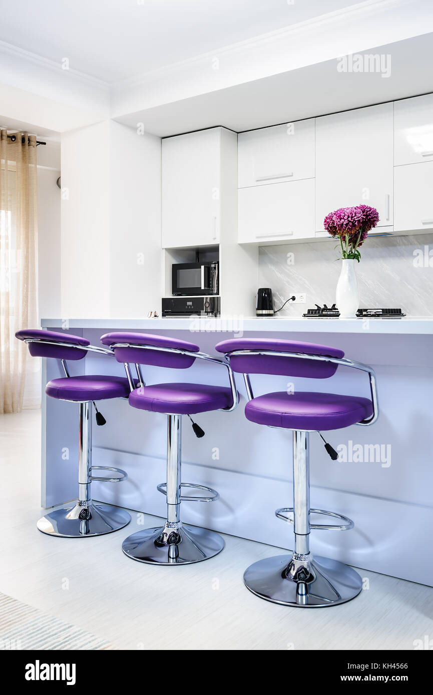 white dining table in modern kitchen Stock Photo - Alamy