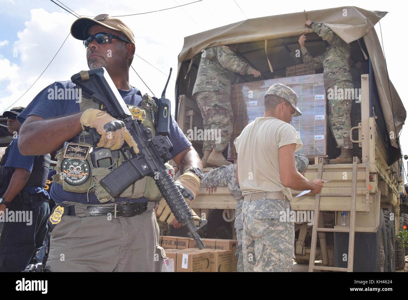 An agent with Coast Guard Investigative Services provides security