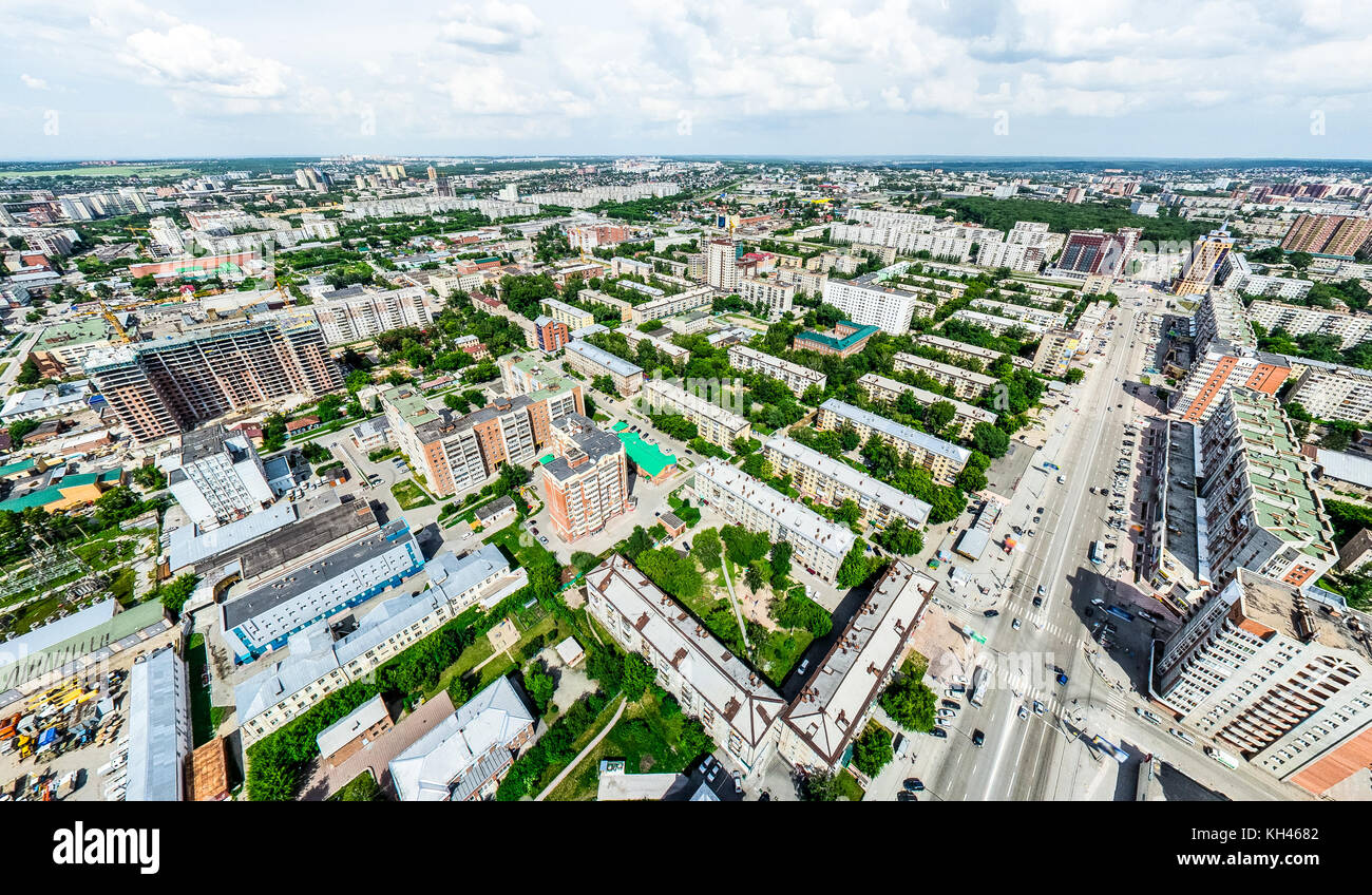 Aerial city view with crossroads and roads, houses, buildings, parks ...