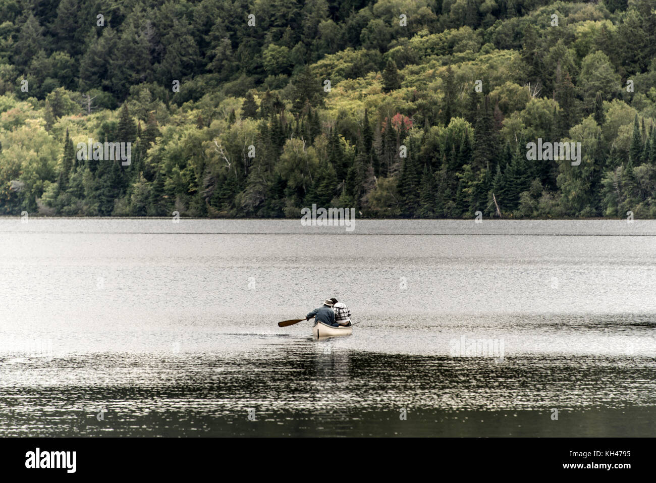 Canada Ontario Lake of two rivers Couple on a Canoe Canoes on the water